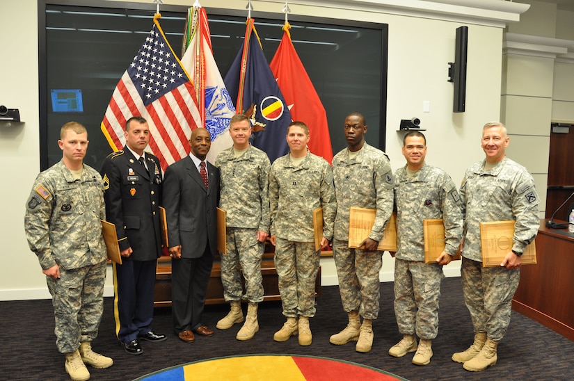 The U.S. Army's top instructors stand with Gen. David Perkins, the commanding general of U.S. Army Training and Doctrine Command, during TRADOC's Instructor of the Year Ceremony at the Morelli Auditorium on Fort Eustis, Va., May 30, 2014. (U.S. Army photo by Anthony C. OBryant/Released)