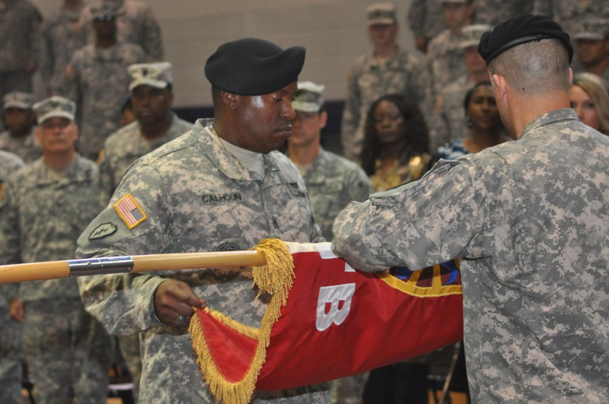 U.S. Army Command Sgt. Maj. Mathew Calhoun, Special Troops Battalion, 7th Transportation Brigade (Expeditionary) command sergeant major, cases the colors of STB with Lt. Col. Noah Cloud, STB commander during an inactivation ceremony at Fort Eustis, Va., May 28, 2014.  The STB is the last unit to inactivate within the 7th Trans. Bde. (Ex) as a result of the brigade’s transformation. (U.S. Army photo by Sgt. Stefanie Warner/Released)