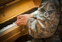 Senior Airman David Gonzalez, 791st Missile Security Forces Squadron defender, plays piano during a volunteer event at a nursing home in Minot, N.D., May 3, 2014. In addition to piano, Gonzalez also plays guitar and drums, as well as sings. (U.S. Air Force photo/Airman 1st Class Apryl Hall)