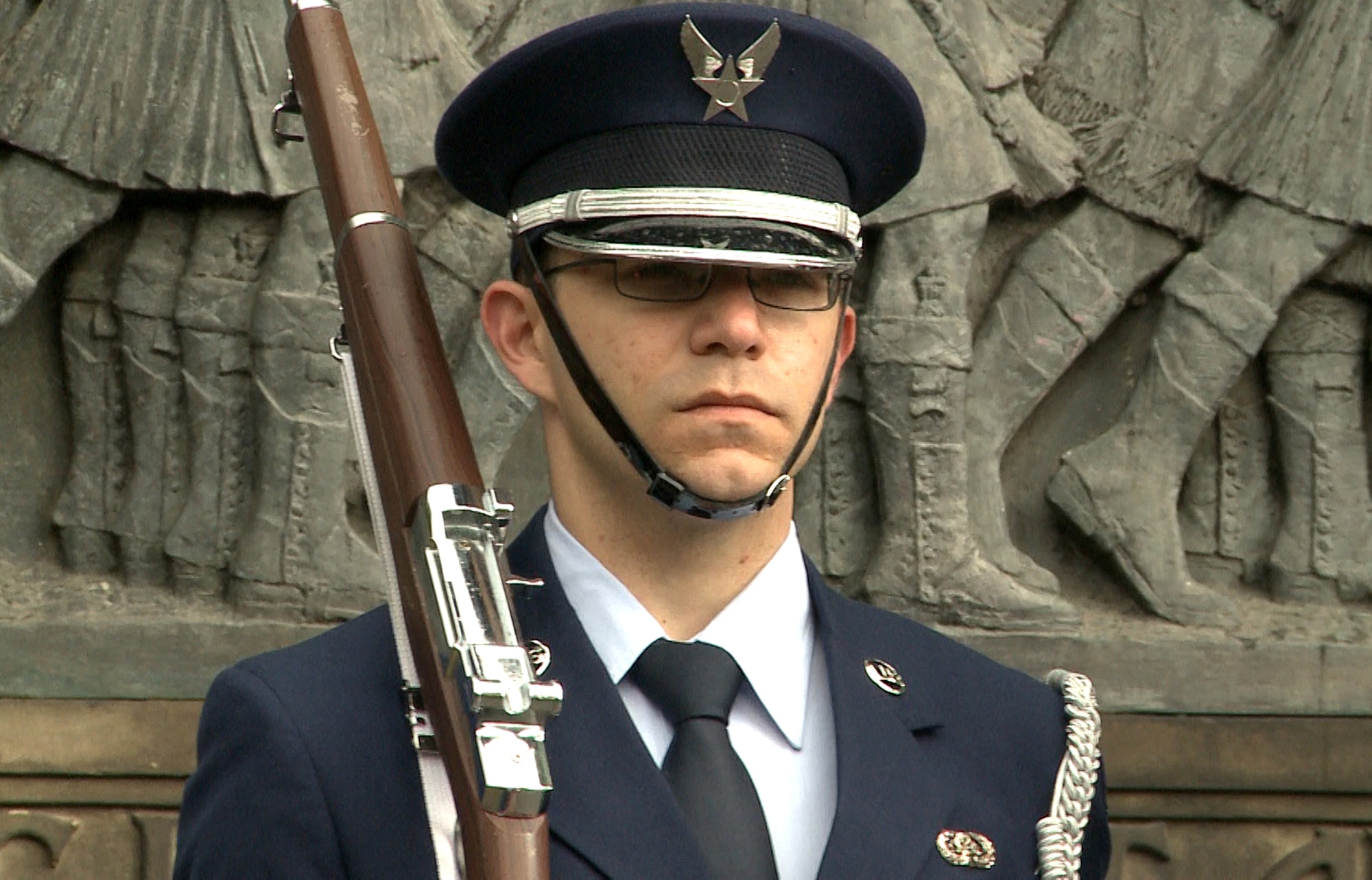 Airman 1st Class Kyle Mitchell, RAF Lakenheath Honor Guard rifle bearer, stands at attention during the 80th Scottish-American Memorial Day service at West Princes Street Gardens, Scotland, May 26, 2014.  The ceremony was held to commemorate the Scottish-American soldiers who sacrificed their lives during the Great War. (U.S. Air Force photo by Airman 1st Class Amanda Sampson/Released)