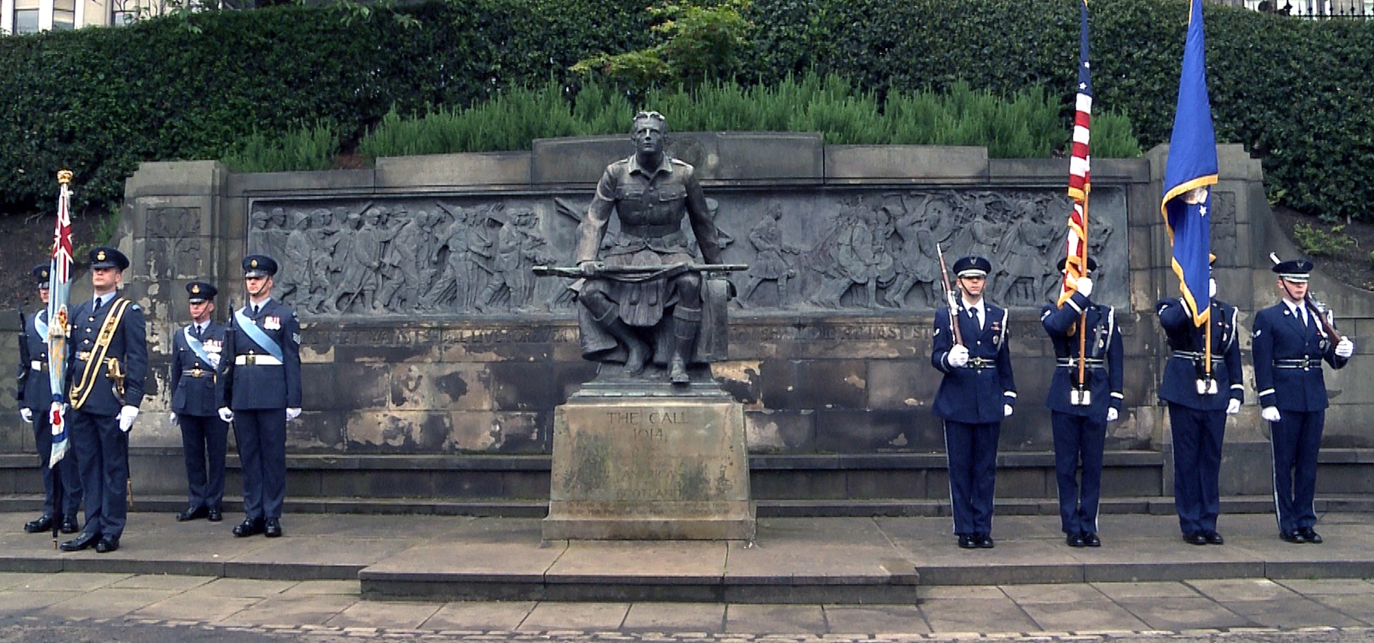 The RAF Lakenheath Honor Guard, right, stands with members of the British armed forces during the 80th Scottish-American Memorial Day Service at West Princes Street Gardens, Scotland, May 26, 2014. The ceremony took place in front of “The Call” monument, which was funded by Americans to commemorate the Scottish-American soldiers who sacrificed their lives during the Great War. (U.S. Air Force photo by Airman 1st Class Amanda Sampson/Released)