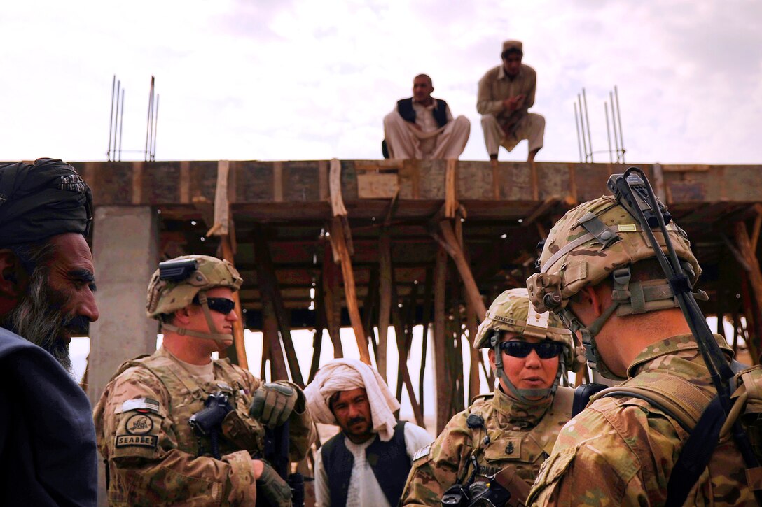 Members of Kandahar Provincial Reconstruction Team conduct a site survey of a bazaar in Kandahar, Afghanistan, March 29, 2012. The team includes U.S. service members and civilians deployed to the Kandahar province to assist in rebuilding and stabilizing the local government and infrastructure. 
