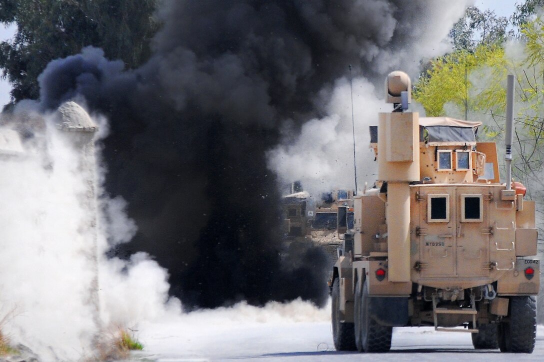 A U.S. Army explosive ordnance disposal unit safely detonates an improvised explosive device on the side of Route Crowbar in Khowst province, Afghanistan, March 24, 2012. The soldiers are assigned to the 25th Infantry Division's 4th Brigade Combat Team. 
