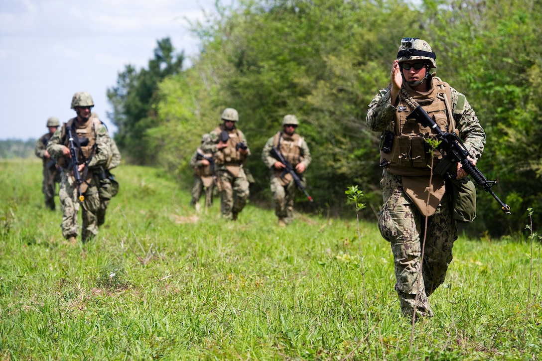 U.S. Navy Seabees execute a reconnaissance patrol during a field training exercise, March 20, 2012, at Camp Shelby, Miss. The exercise provides a robust training environment where Seabee forces plan and execute multiple mission essential tasks before deployment.  

