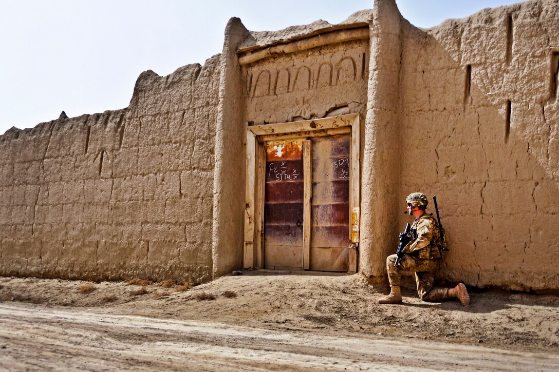 U.S. Army 1st Lt. Seth Curry secures an entrance in the village of Sader Kheyl near Combat Outpost Rahman Kheyl, Afghanistan, March 17, 2012. Curry is an executive officer assigned to Company B, 3rd Battalion, 509th Infantry Regiment.  
