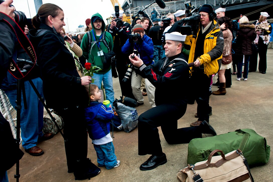 Navy Petty Officer 1st Class Christopher Kight proposes to his girlfriend after disembarking from the aircraft carrier USS John C. Stennis in Bremerton, Wash., March 2, 2012. The John C. Stennis is returning from a seven-month deployment. Kight is a damage controlman.  
