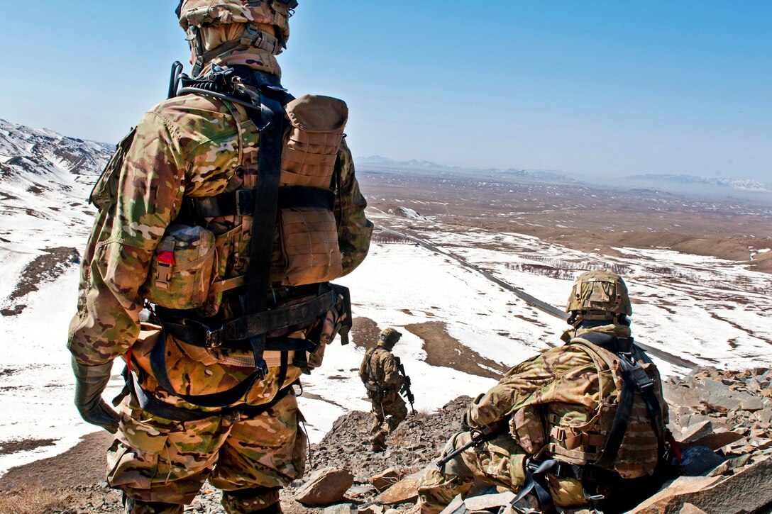 U.S. Army Spc. Richard Madrid, left, and U.S. Army Command Sgt. Maj. Samuel Murphy, right, observe the view of the horizon at a check point near Daab Pass in the Shinkay district in Afghanistan's Zabul province, Feb. 25, 2012. Madrid and Murphy are assigned to the 2nd Infantry Division's 3rd Stryker Brigade Combat Team.  
