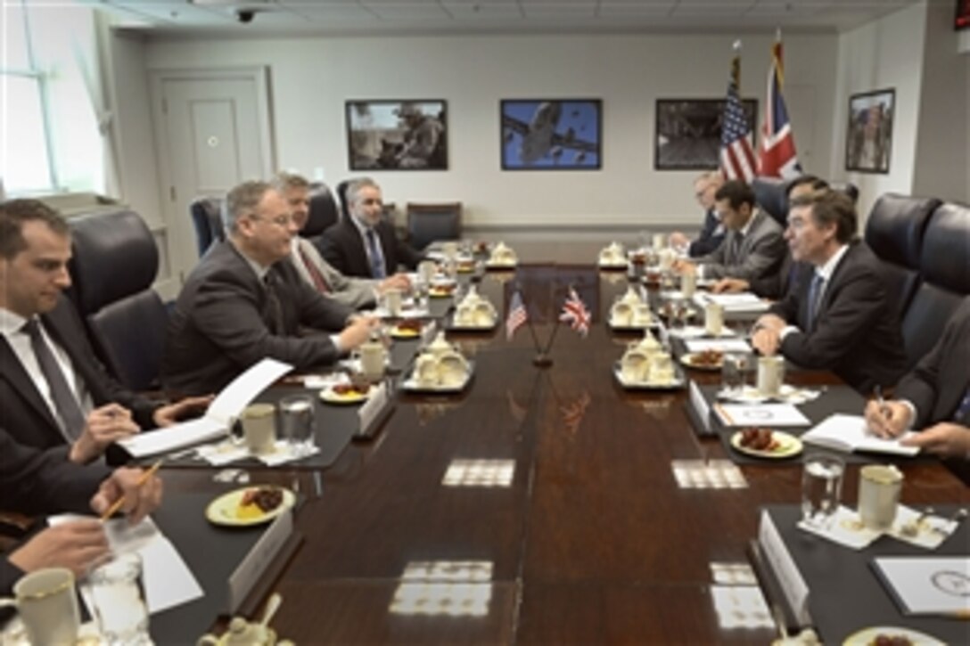 Deputy Defense Secretary Robert Work meets with Philip Dunne, British defense minister for equipment, support and technology at the Pentagon, June 3, 2014. Leaders discussed matters of mutual concern.