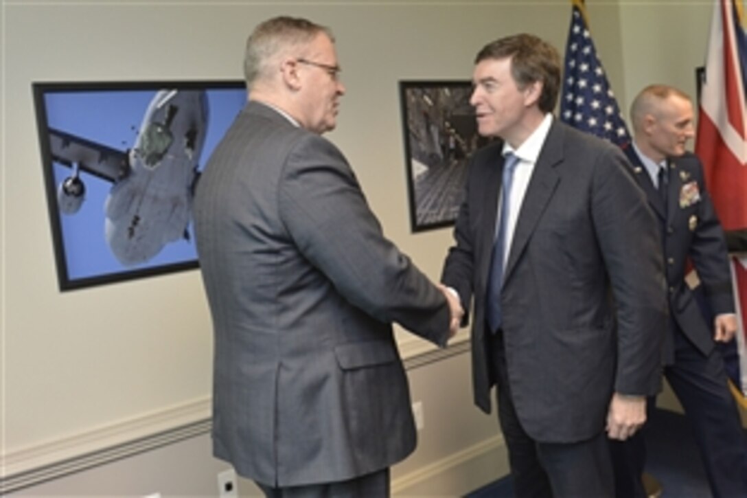 Deputy Defense Secretary Robert Work meets with Philip Dunne, British defense minister for equipment, support and technology at the Pentagon, June 3, 2014. Leaders discussed matters of mutual concern.