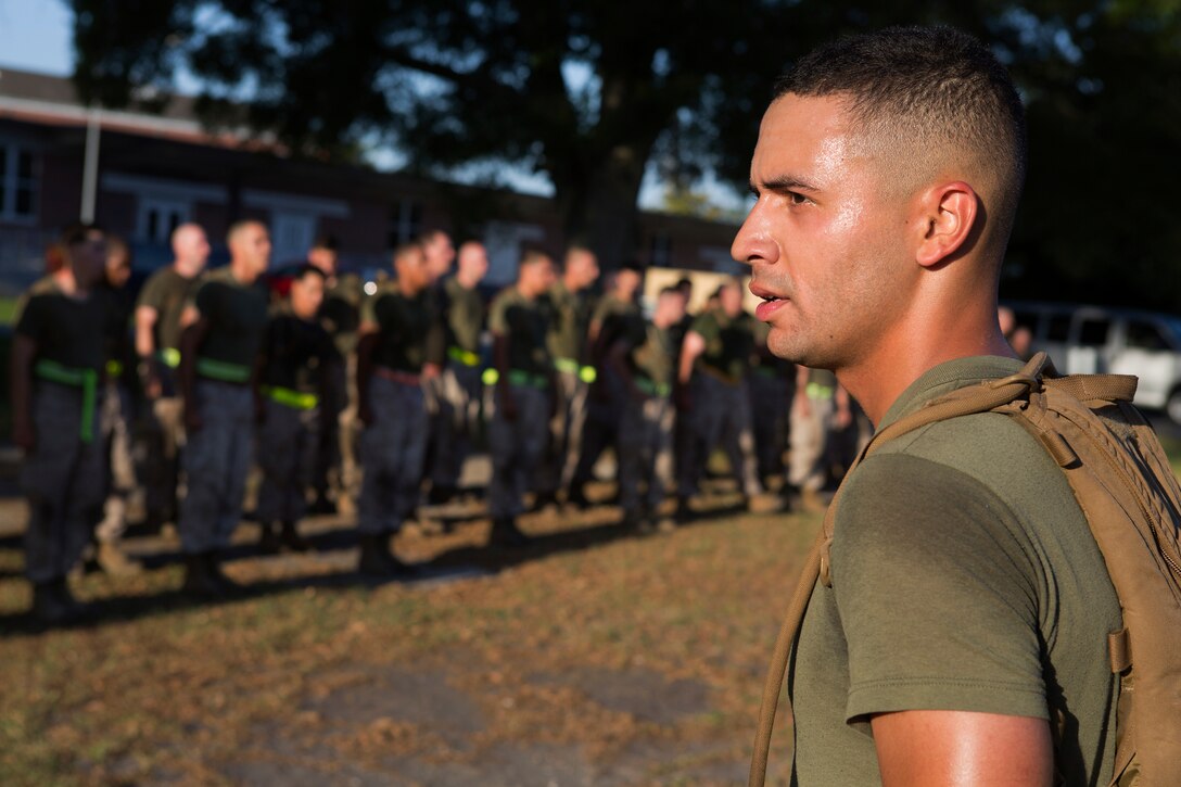 U.S. Marine Corps Sgt. Leonardo Avilagonzalez, a field radio operator with the 26th Marine Expeditionary Unit, commands a formation during a noncommissioned officer (NCO) led physical training session aboard Camp Lejeune, N.C., June 3, 2014. The training was designed to build camaraderie, morale, and allow NCOs an opportunity to expand their authority within the unit. (U.S. Marine Corps photo by Lance Cpl. Andre Dakis, 26th MEU Combat Camera/Released)