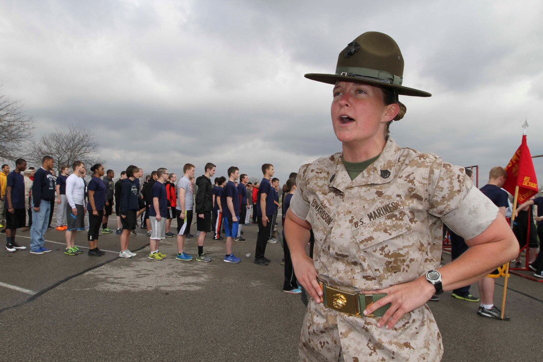 U.S. Marine Corps Staff Sgt. Charlotte Edwardson, a High Springs, Fla., native and a drill instructor out of Marine Corps Recruit Depot Parris Island, S.C., encourages poolees to run faster and scream louder during Recruiting Station Detroit's annual pool function at Lake Erie Metropark, May 3, 2014. More than 350 Recruiting Station Detroit Marines and poolees from across the 14,000-square miles of southeastern Michigan and western Ohio participated in the pool function. Recruiting Sub-Station Mount Clemens would go on to win the overall trophy after competing in more than five field meet type events. (U.S. Marine Corps photo by Sgt. Elyssa Quesada/Released)