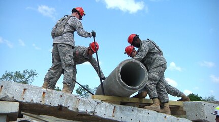 The Missouri Chemical, Biological, Radiological, Nuclear and high Explosive (CBRNE) Search and Extraction team practice moving heavy concrete objects using safety techniques at the Boone County (Missouri) Training Center May 17, 2014. Nearly 200 Missouri Army and Air Guard members participated in the training over the weekend. 