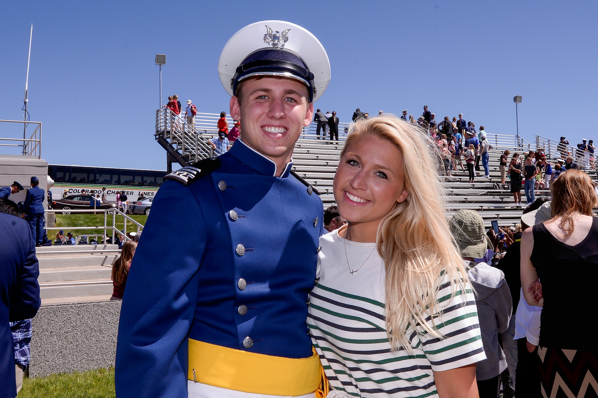 Second Lt. Blake Jones poses with his sister, Navy Ensign Madison Jones, after graduating May 28, 2014 from the U.S. Air Force Academy, Colo. The Jones siblings chose the same path of military service by becoming Air Force, Navy and Army officers. (U.S. Air Force Photo/Liz Copan)