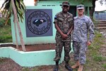 Honduran Capt. Sergio Israel Ballesteros (left), a member of the 1st Engineer Battalion, and Army Capt. Juan Valencia, a battle captain for Beyond the Horizon 2012 Honduras, and a member of Headquarters and Headquarters Detachment, 1140th Engineer Battalion, 35th Engineer Brigade, work together after meeting each other eight years ago at the U.S. Army Engineer Officer Basic Course at Fort Leonard Wood, Mo.