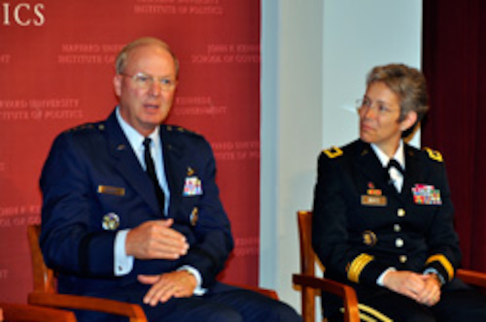 Air Force Gen. Craig McKinley, the chief of the National Guard Bureau, answers a question as Army Brig. Gen. Julie Bentz, director of strategic capabilities policy, National Security Council, listens during a panel discussion on the military's role in disaster response at Harvard University's John F. Kennedy School of Government recently. The panel was the conclusion of the second annual General and Flag Officer Homeland Security Executive Seminar at Harvard University. Fifty professionals throughout the country from the rank of colonel to major general and Defense Department civilians attended the course designed to provide a broad understanding of federal and state emergencies, crisis decision making and multi-agency collaboration.