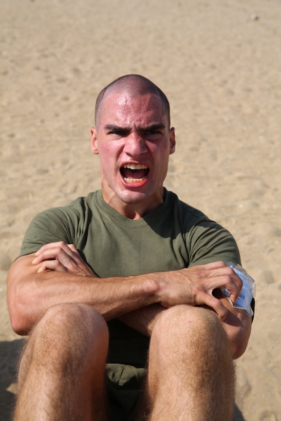 Recruit Julian M. Arrogo, an Sant Antonio, Texas native, Platoon 2163, Hotel Company, 2nd Recruit training Battalion, begins a maximum set of sit-ups for 60 seconds during a Circuit Course aboard the Marine Corps Recruit Depot San Diego, May 29. Each exercise was different and physically challenged the recruits in a different way using various muscle groups.