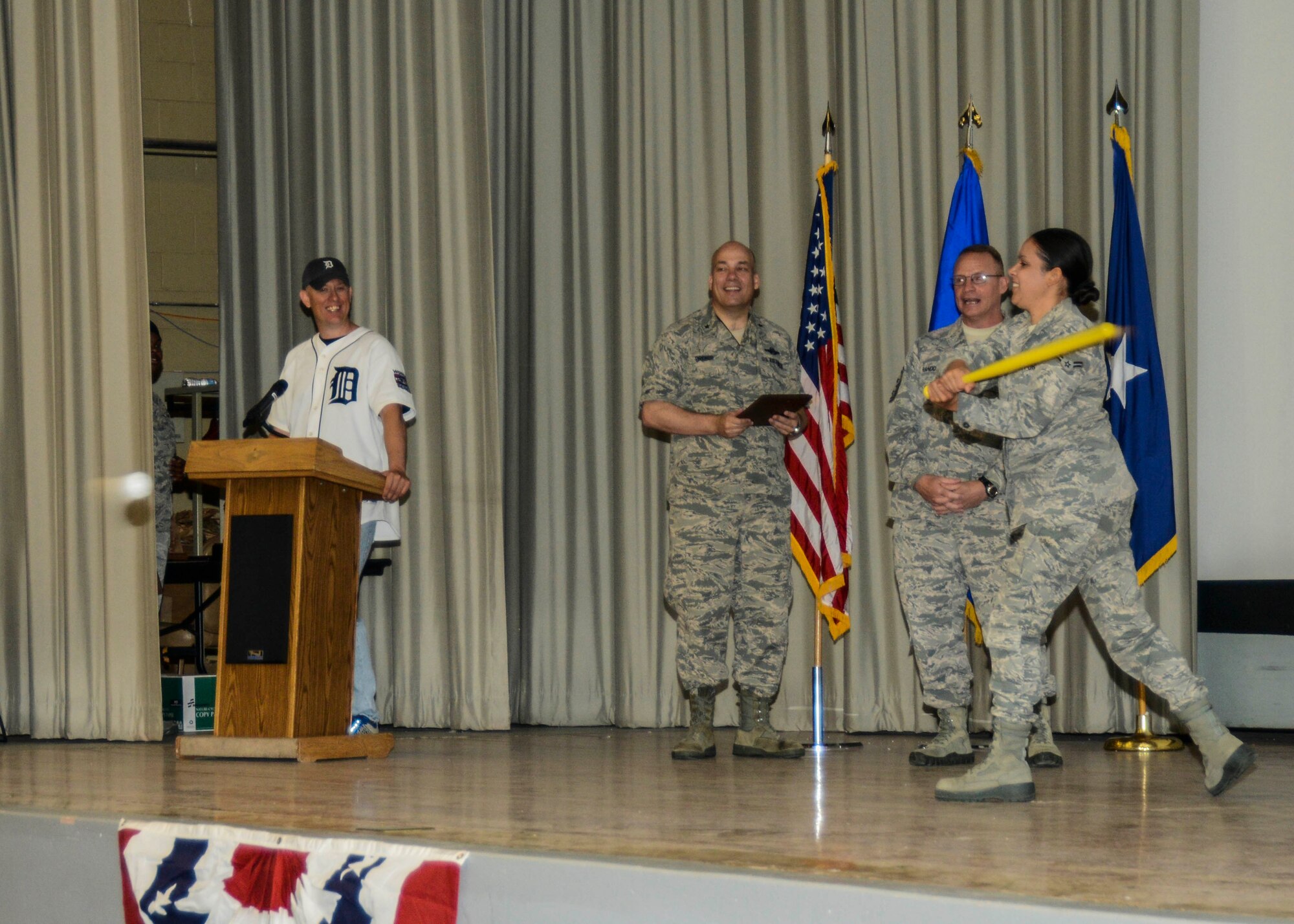 Airman of the Quarter award winner Airman 1st Class Raquel Caramanno slaps a pitch into the crowd before receiving her award. (U.S. Air Force photo by Rebecca Amber)
