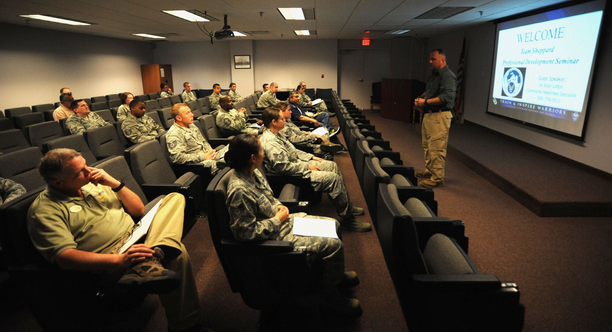Erich Lofton, Airmen and Family Readiness Center community readiness specialist, briefs Airmen at a professional development seminar May 29, 2014. The A&FRC oftentimes gives advice on how to optimize work place interactions and experience. (U.S. Air Force photos by Airman 1st Class Jelani Gibson) 