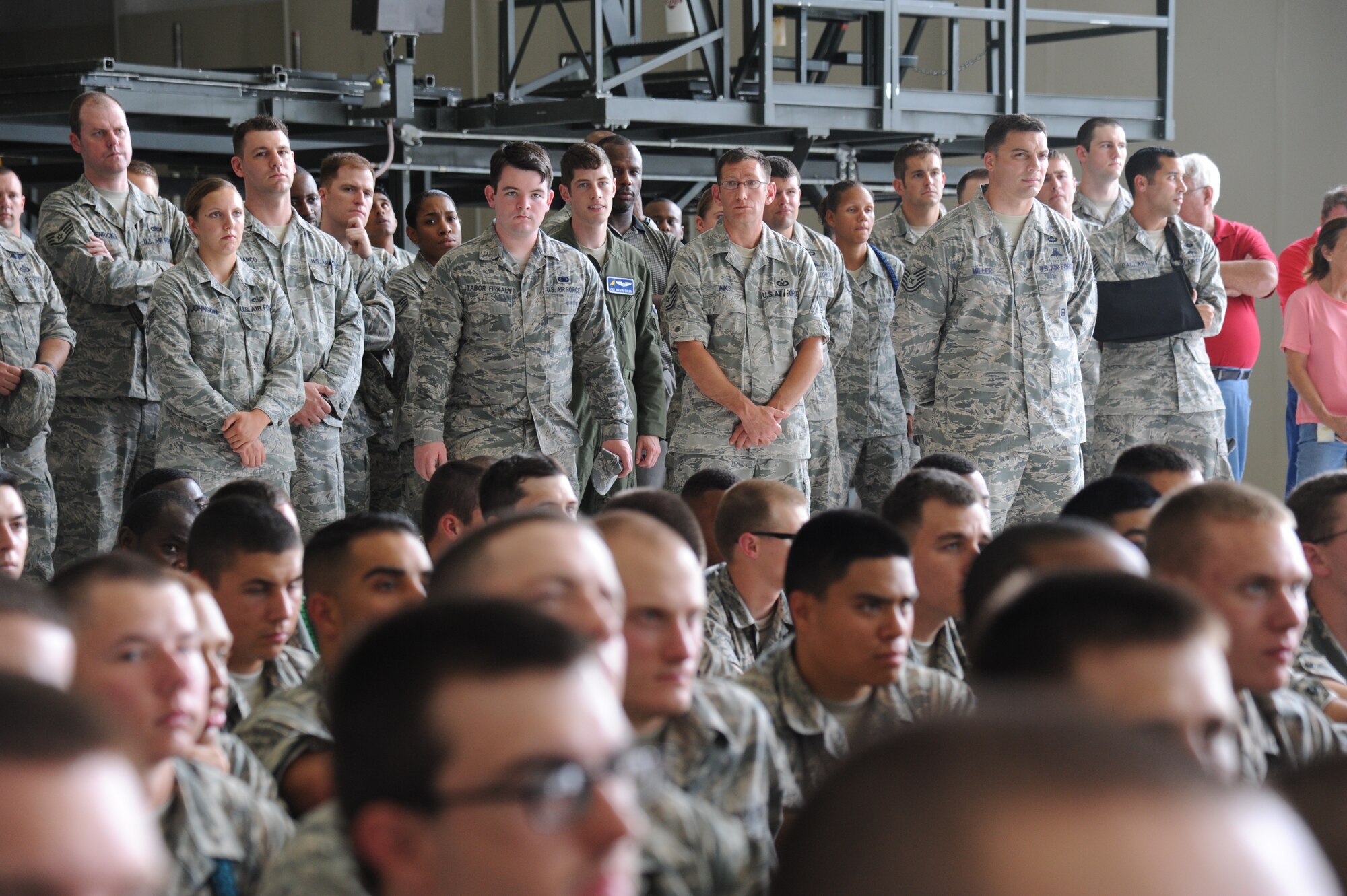 Keesler personnel listen to the Secretary of the Air Force, Deborah Lee James, as she speaks during an All Call May 30, 2014, at the dual bay hangar at Keesler Air Force Base, Miss.  James also toured the Levitow Training Support Facility and the 403rd Wing.  (U.S. Air Force photo by Kemberly Groue)