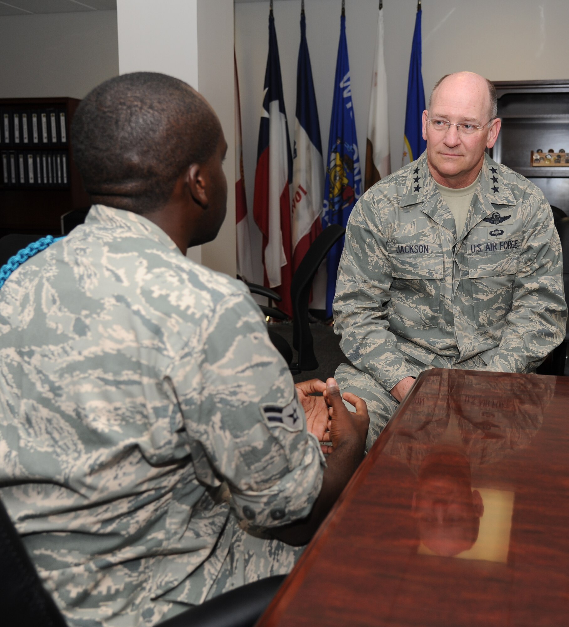 Lt. Gen. James Jackson, chief of Air Force Reserve, Headquarters U.S. Air Force, Washington, D.C., and commander, Air Force Reserve Command, Robins Air Force Base, Ga., speaks with Airman 1st Class Dwaine Holman, 338th Training Squadron, about his duties as a teal rope Airman during a base orientation visit with the Secretary of the Air Force, Deborah Lee James, May 30, 2014, at Keesler Air Force Base, Miss.  James also toured the 403rd Wing and held an All Call for Keesler personnel. (U.S. Air Force photo by Kemberly Groue)