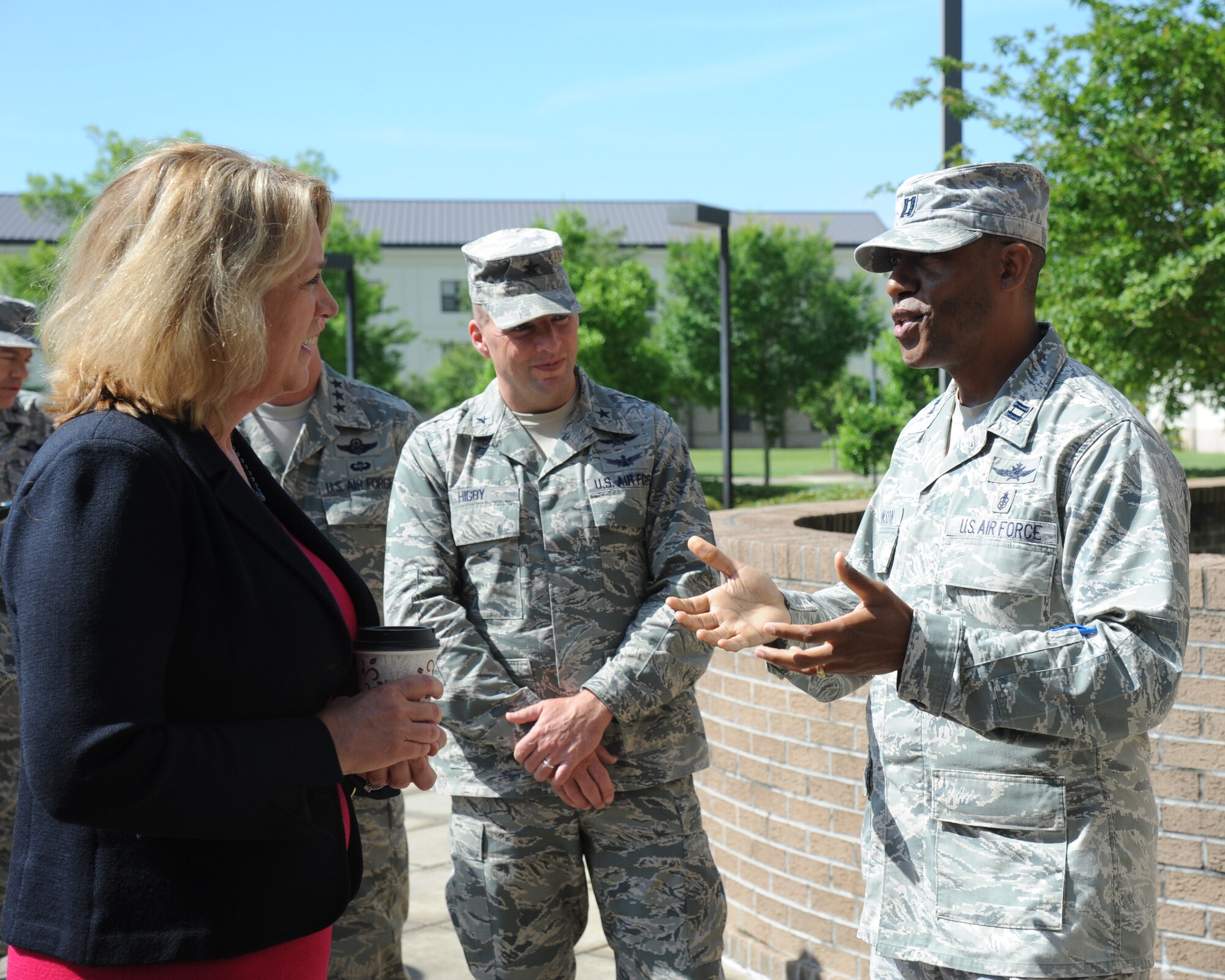 Capt. James Johnson, 336th Training Squadron director of operations, welcomes Secretary of the Air Force Deborah Lee James to Holbrook Manor at Keesler Air Force Base, Miss., during a base orientation visit May 30, 2014.,as Brig. Gen. Patrick Higby, 81st Training Wing commander, stands by.   James also toured the 403rd Wing and held an All Call for Keesler personnel. (U.S. Air Force photo by Kemberly Groue)