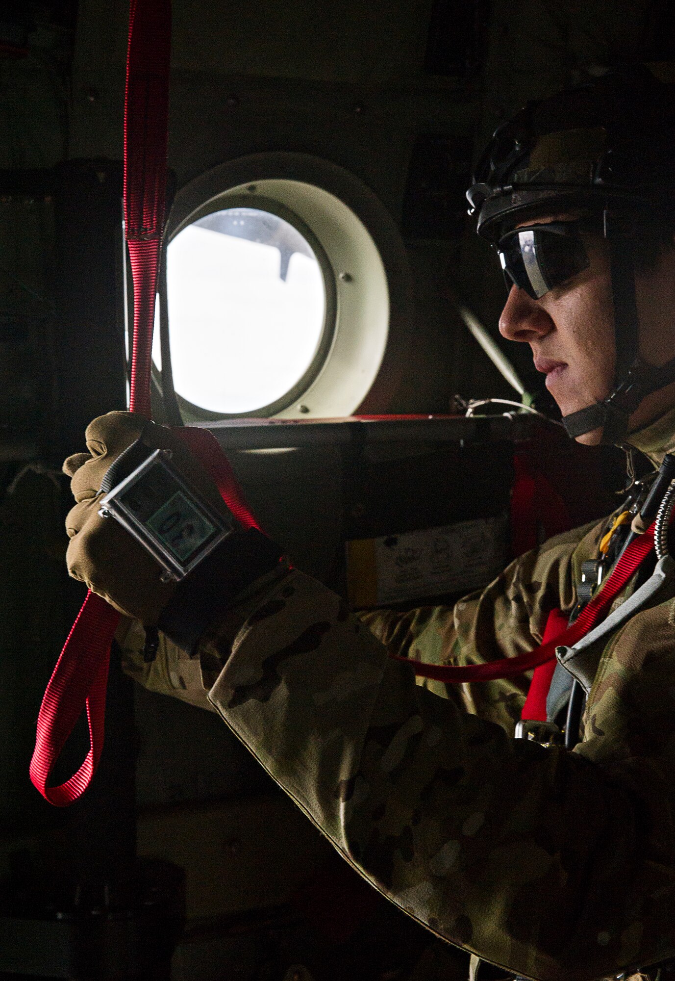 KEFLAVIK, Iceland -- Senior Airman Austen, 48th Air Expeditionary Group pararescueman, deployed for Icelandic Air Policing prepare for a static-line jump during a training mission near Keflavik International Airport June 3, 2014. The pararescuemen, coupled with the C-130J Super Hercules crew, enable the U.S. Air Force F-15C Eagle pilots in Iceland to travel farther over the icy Atlantic by providing a quick response rescue force. (U.S. Air Force photo/Tech. Sgt. Benjamin Wilson)(Released)