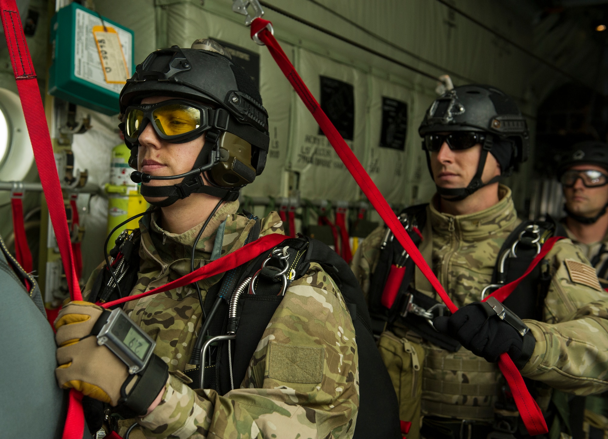 KEFLAVIK, Iceland -- Pararescuemen deployed with the 48th Air Expeditionary Group for Icelandic Air Policing prepare for a static-line jump during a training mission near Keflavik International Airport June 3, 2014. The pararescuemen, coupled with the C-130J Super Hercules crew, enable the U.S. Air Force F-15C Eagle pilots in Iceland to travel farther over the icy Atlantic by providing a quick response rescue force. (U.S. Air Force photo/Tech. Sgt. Benjamin Wilson)(Released)
