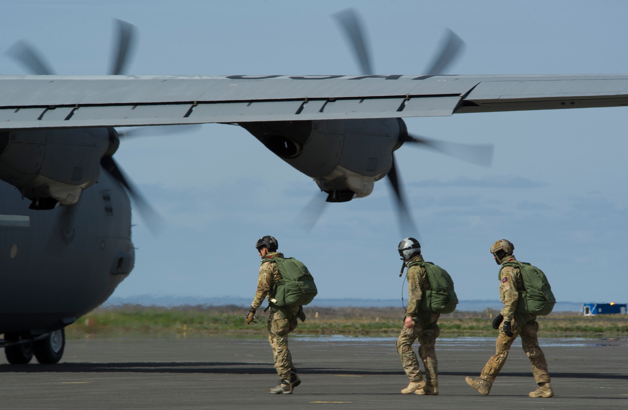 KEFLAVIK, Iceland -- Pararescuemen deployed with the 48th Air Expeditionary Group for Icelandic Air Policing board a C-130J Super Hercules during a training mission at Keflavik International Airport May 22, 2014. The fighter pilots protecting Iceland’s air sovereignty during the deployment are able to travel farther out over the arctic because of the quick-response rescue capability provided by the pararescuemen and C-130 crew. (U.S. Air Force photo/Tech. Sgt. Benjamin Wilson)(Released)
