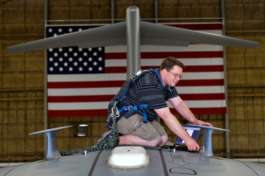 James Martin, 62nd Maintenance Squadron integrated avionics technician, replaces an ultra-high frequency satellite antenna on a C-17 Globemaster III June 4, 2014, at Joint Base Lewis-McChord, Wash. A McChord maintenance Airman noticed their unit was replacing a significant amount of the antennas because they were failing a very strict manufacturer’s inspection but were not being identified by the air crews as defective in any way. (U.S. Air Force photo/Staff Sgt. Russ Jackson)