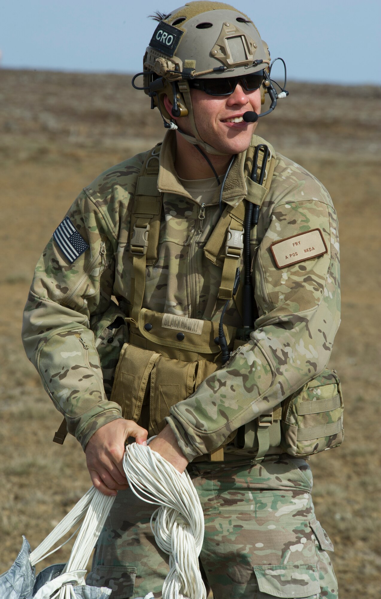 KEFLAVIK, Iceland -- Capt. Paul, 48th Air Expeditionary Group combat rescue officer, packs his parachute after jump training near Keflavik International Airport May 22, 2014. The pararescuemen, coupled with the C-130J Super Hercules crew, enable the U.S. Air Force F-15C Eagle pilots in Iceland to travel farther over the icy Atlantic by providing a quick response rescue force. (U.S. Air Force photo/Tech. Sgt. Benjamin Wilson)(Released)