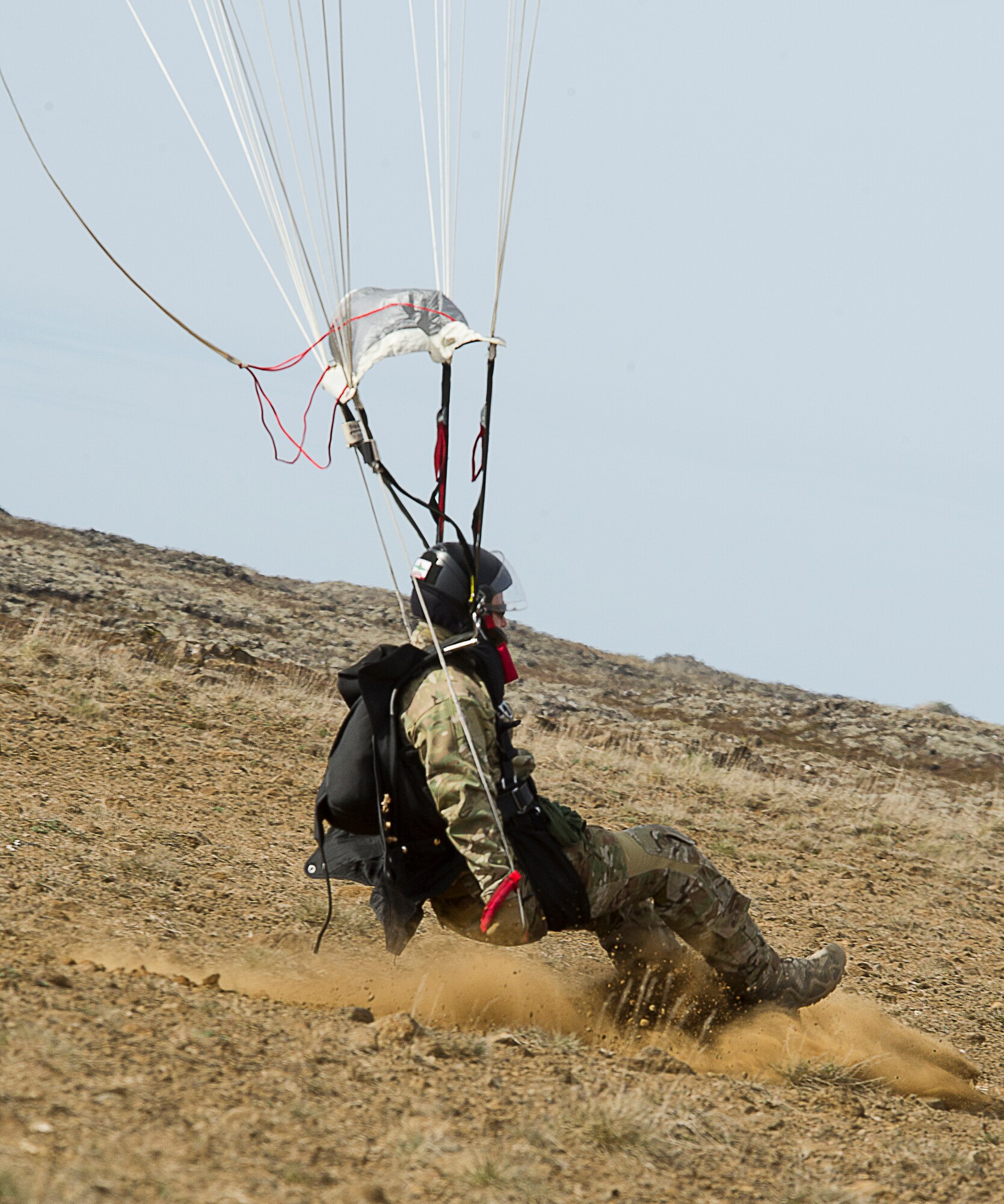 KEFLAVIK, Iceland -- A pararescueman deployed with the 48th Air Expeditionary Group for Icelandic Air Policing lands during jump training near Keflavik International Airport May 22, 2014. The pararescuemen, coupled with the C-130J Super Hercules crew, enable the U.S. Air Force F-15C Eagle pilots in Iceland to travel farther over the icy Atlantic by providing a quick response rescue force. (U.S. Air Force photo/Tech. Sgt. Benjamin Wilson)(Released)