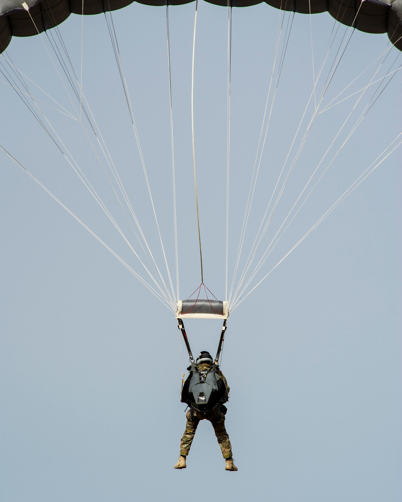 KEFLAVIK, Iceland -- A pararescueman deployed for Icelandic Air Policing with the 48th Air Expeditionary Group lands during jump training near Keflavik International Airport May 22, 2014. The Pararescueman is deployed from the 31st Rescue Squadron to support the NATO mission of ensuring Iceland’s air sovereignty. (U.S. Air Force photo/Tech. Sgt. Benjamin Wilson)(Released)
