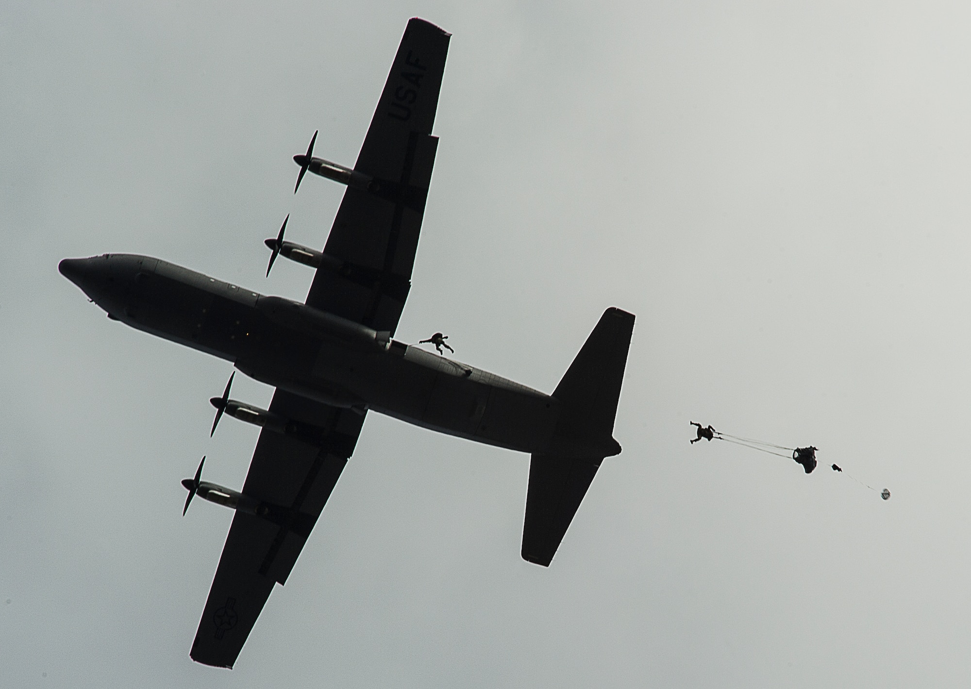 KEFLAVIK, Iceland -- Pararescuemen deployed for Icelandic Air Policing with the 48th Air Expeditionary Group perform a static line jump from a C-130J Super Hercules during training near Keflavik International Airport, May 22, 2014. The Pararescuemen are deployed from the 31st Rescue Squadron to support the NATO mission of ensuring Iceland’s air sovereignty. (U.S. Air Force photo/Tech. Sgt. Benjamin Wilson)(Released)
