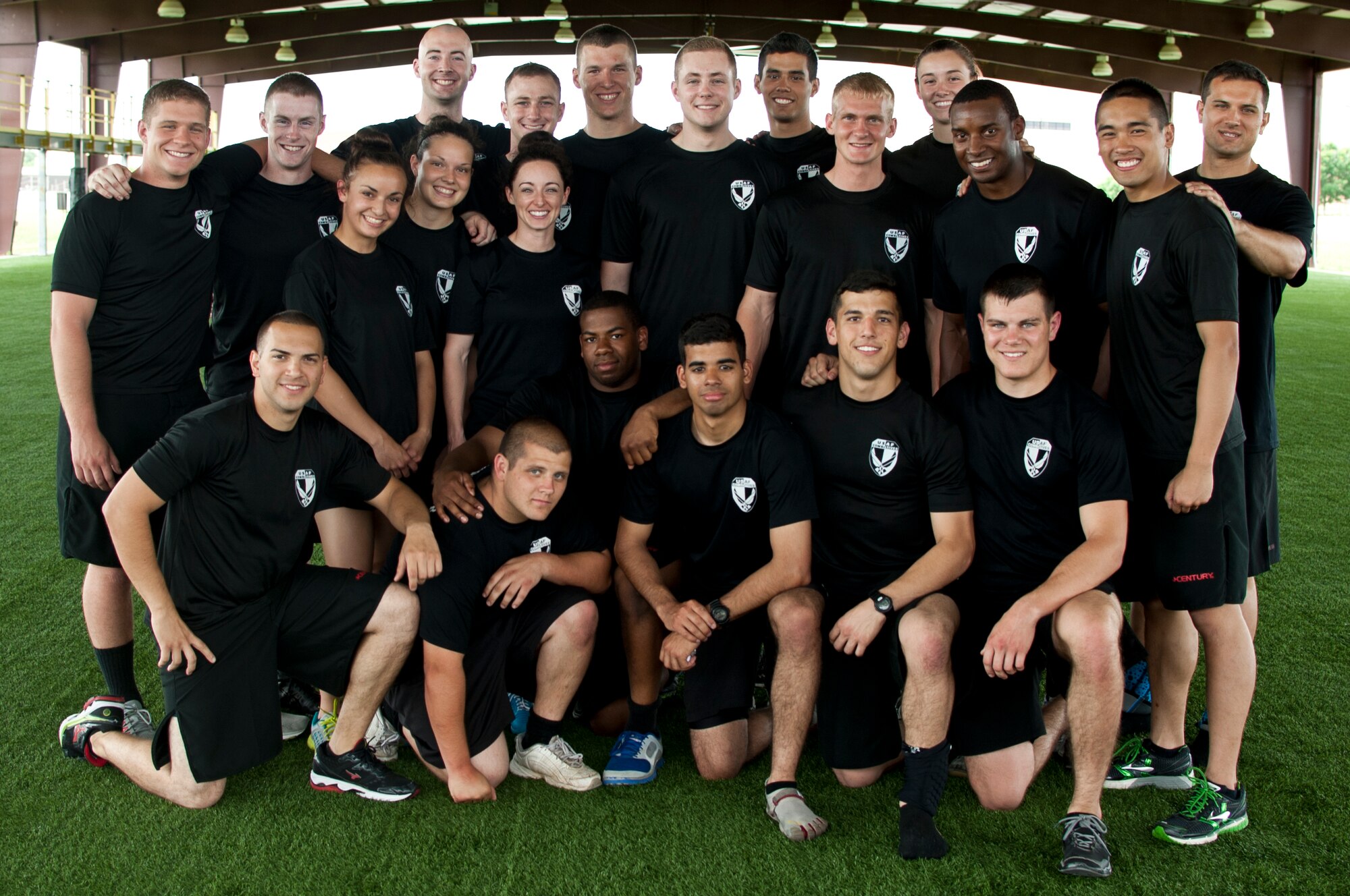 Air Force Reserve Officer Training Corps instructors pose for a group photo after teaching a course during combatives training at Maxwell Air Force Base, May 29, 2014. The instructors themselves are ROTC cadets who, after completing field training the previous year, volunteer to become certified instructors so they can return to instruct cadets currently going through field training. (U.S. Air Force Photo by Staff Sgt. Gregory Brook)