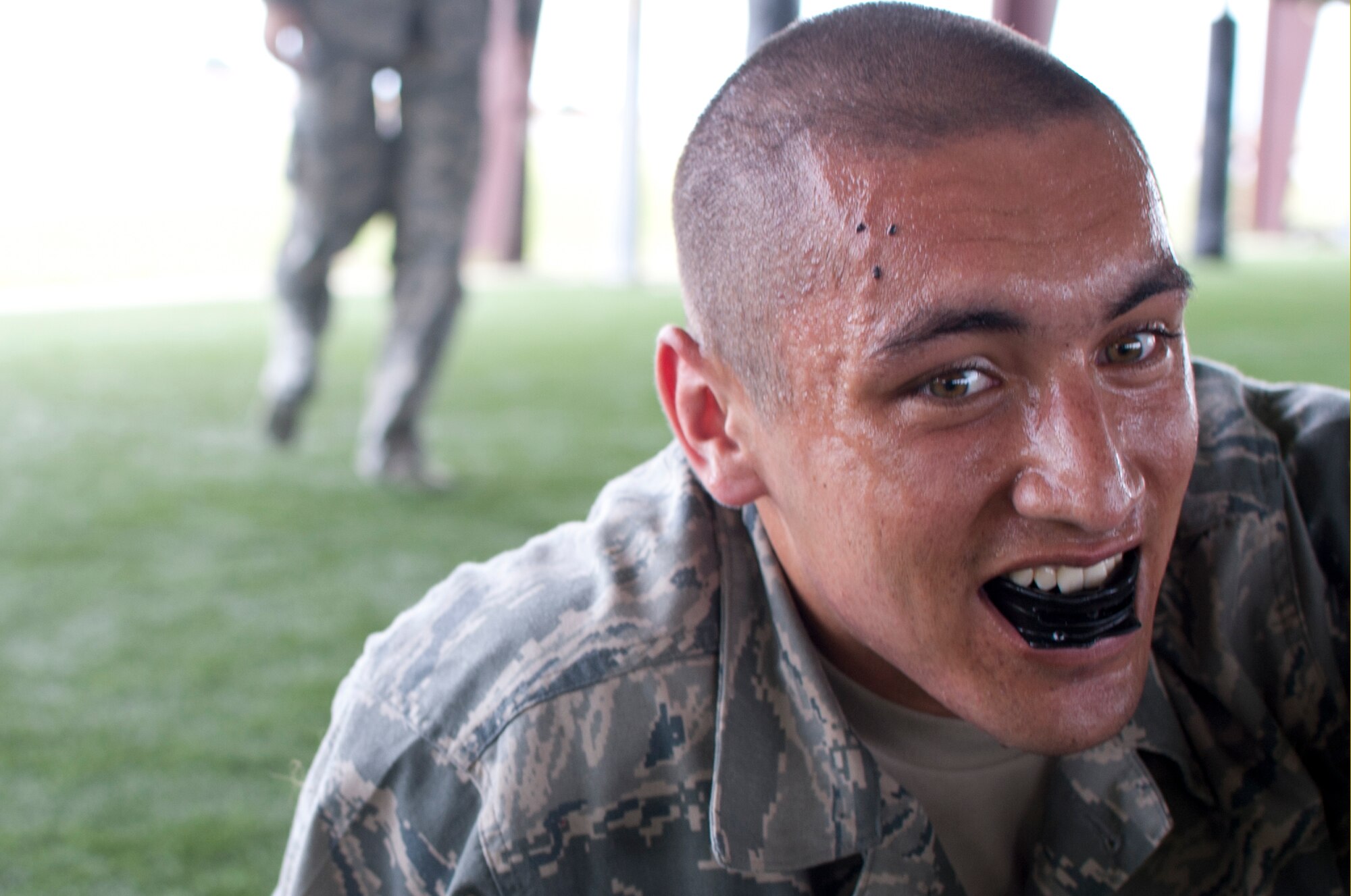 Peter Thomas, a cadet in the Air Force Reserve Officer Training Corps, rests after a sparring session during the combatives portion of field training, held at Maxwell Air Force Base, May 29, 2014.  The field training is a two-week summer program completed by AFROTC cadets in their junior year of college. (U.S. Air Force Photo by Staff Sgt. Gregory Brook)