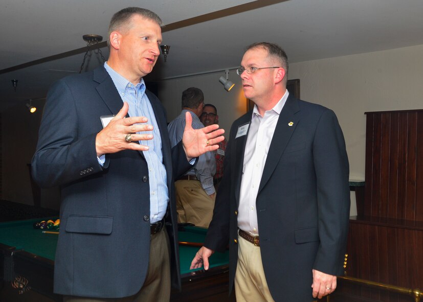 Col. Rick Moore, 436th Airlift Wing commander, talks with Brig. Gen. Evan Miller, U.S. Air Force Academy vice superintendent, at a social May 20, 2014, in Colorado Springs, Colo. The social was one of the events held during the community relations tour Team Dover civic leaders and base leadership participated in. (U.S. Air Force photo/Airman 1st Class Ashlin Federick)