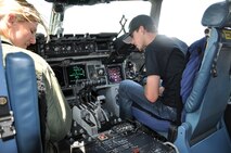 WRIGHT-PATTERSON AIR FORCE BASE, Ohio – Capt. Emily Nankivell, 89th Airlift Squadron C-17 pilot, shows NASCAR Camping World Truck Series driver Ryan Blaney the flightdeck of a C-17 Globemaster III during his visit to the 445th Airlift Wing June 3. Ohio native Blaney was visiting the base for a promotional stop, signing autographs and visiting with fans. (U.S. Air Force photo/Stacy Vaughn)  
