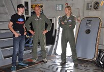 WRIGHT-PATTERSON AIR FORCE BASE, Ohio – NASCAR Camping World Truck Series driver Ryan Blaney learns about the mission of the C-17 Globemaster III from Senior Master Sgt. Gary Fernandez and Capt. Emily Nankivell, both from the 89th Airlift Squadron, during a visit to the 445th Airlift Wing June 3. Ohio native Blaney was visiting the base for a promotional stop, signing autographs and visiting with fans. (U.S. Air Force photo/Stacy Vaughn)  