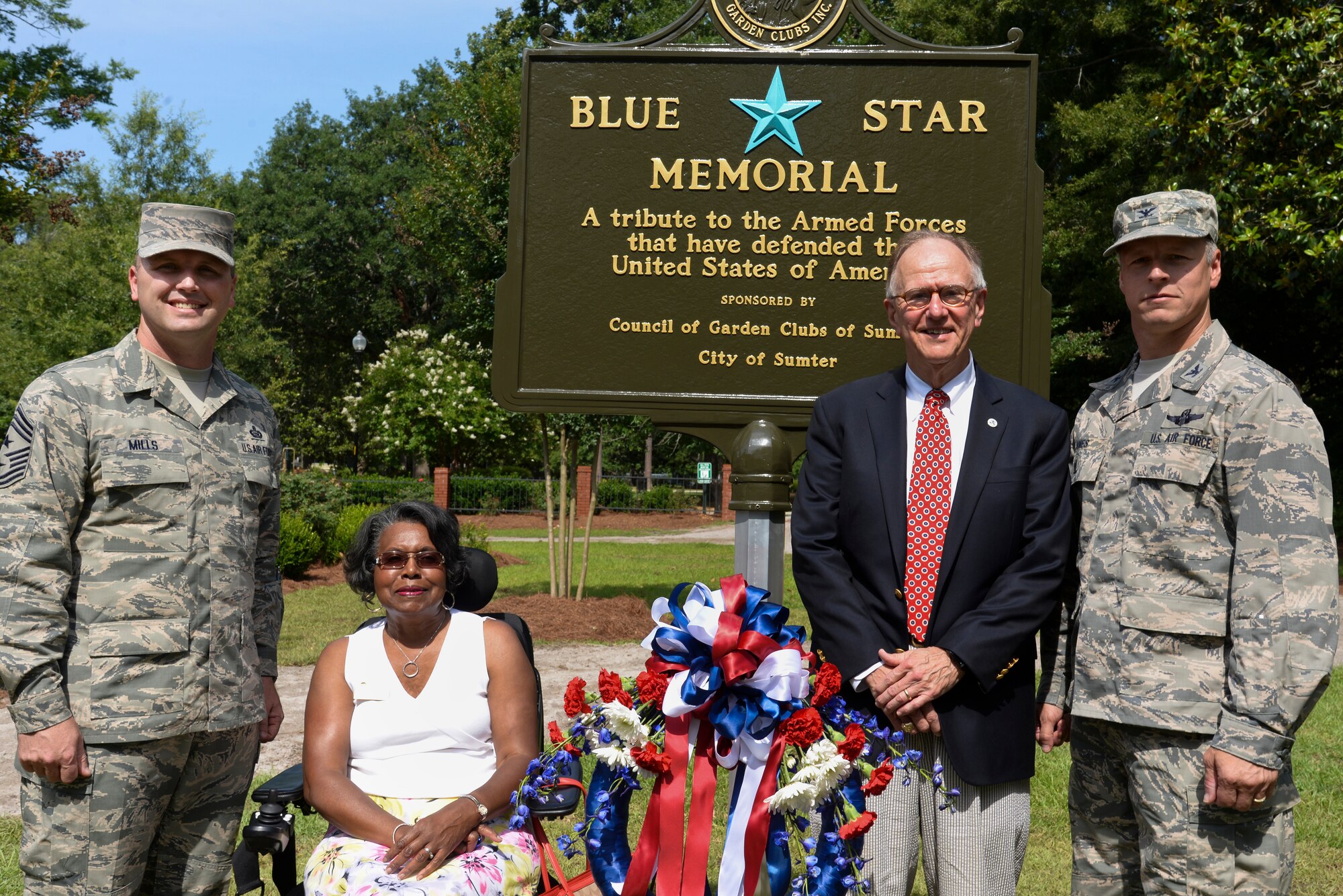(From left to right) U.S. Air Force Chief Master Sgt. Charles Mills, 20th FW command chief, Ione Dwyer, city of Sumter councilwoman, Joseph McElveen Jr., city of Sumter Mayor, and Col. William Jones, 20th Fighter Wing vice commander, stand in front of the new Blue Star Memorial sign in Memorial Park, Sumter, S.C., during the city’s Blue Star Memorial dedication ceremony, June 4, 2014. The dedication was hosted by the city of Sumter and the South Carolina Garden Club. The Blue Star flag program started in 1917 to denote families who had children serving in the military. (U.S. Air Force photo by Airman 1st Class Jonathan Bass/Released)