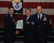 Tech. Sgt. Randa Head, 2nd Munitions Squadron, receives a certificate of promotion from Col. Andrew Gebara, 2nd Bomb Wing commander, and Chief Master Sgt. Stephen Lebrun, 2nd Operations Group, during the May Promotion Ceremony on Barksdale Air Force Base, La., May 30, 2014. (U.S. Air Force photo/Senior Airman Benjamin Gonsier)