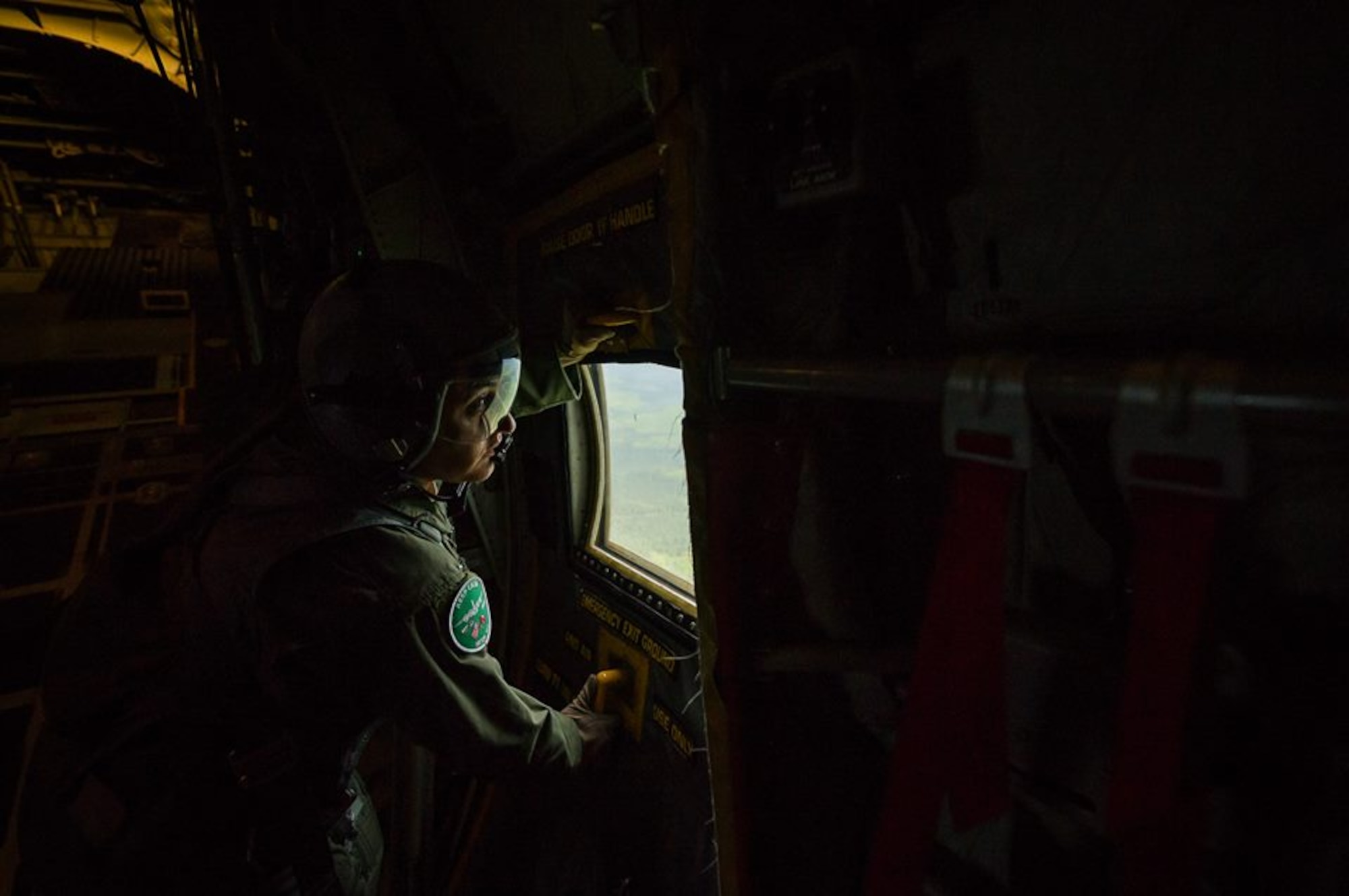 U.S. Air Force Master Sgt. Nattessa Tolle, C-130 Hercules loadmaster with the 302nd Airlift Wing, Peterson Air Force Base, Colo., secures the left side troop door during Maple Flag in Edmonton/Cold Lake, Alberta, Canada, June 2, 2014. Maple Flag is an international exercise designed to enhance the interoperability of C-130 aircrews, maintainers and support specialists in a simulated combat environment. (U.S. Air Force photo by Master Sgt. John R. Nimmo, Sr./Released) 4th Combat Camera Squadron— at Edmonton International Airport.