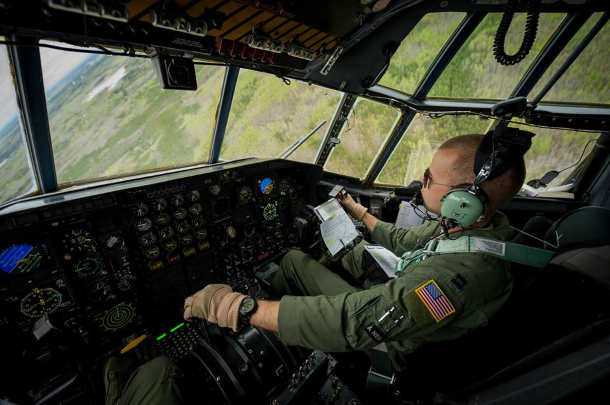 U.S. Air Force Capt. Eric Dahlmann, C-130 Hercules co-pilot with the 302nd Airlift Wing, Peterson Air Force Base, Colo., maneuvers to avoid simulated ground-to-air threats during Maple Flag in Edmonton/Cold Lake, Alberta, Canada, May 28, 2014. Maple Flag is an international exercise designed to enhance the interoperability of C-130 aircrews, maintainers and support specialists in a simulated combat environment. (U.S. Air Force photo by Master Sgt. John R. Nimmo, Sr./Released) 4th Combat Camera Squadron— at Edmonton International Airport.
