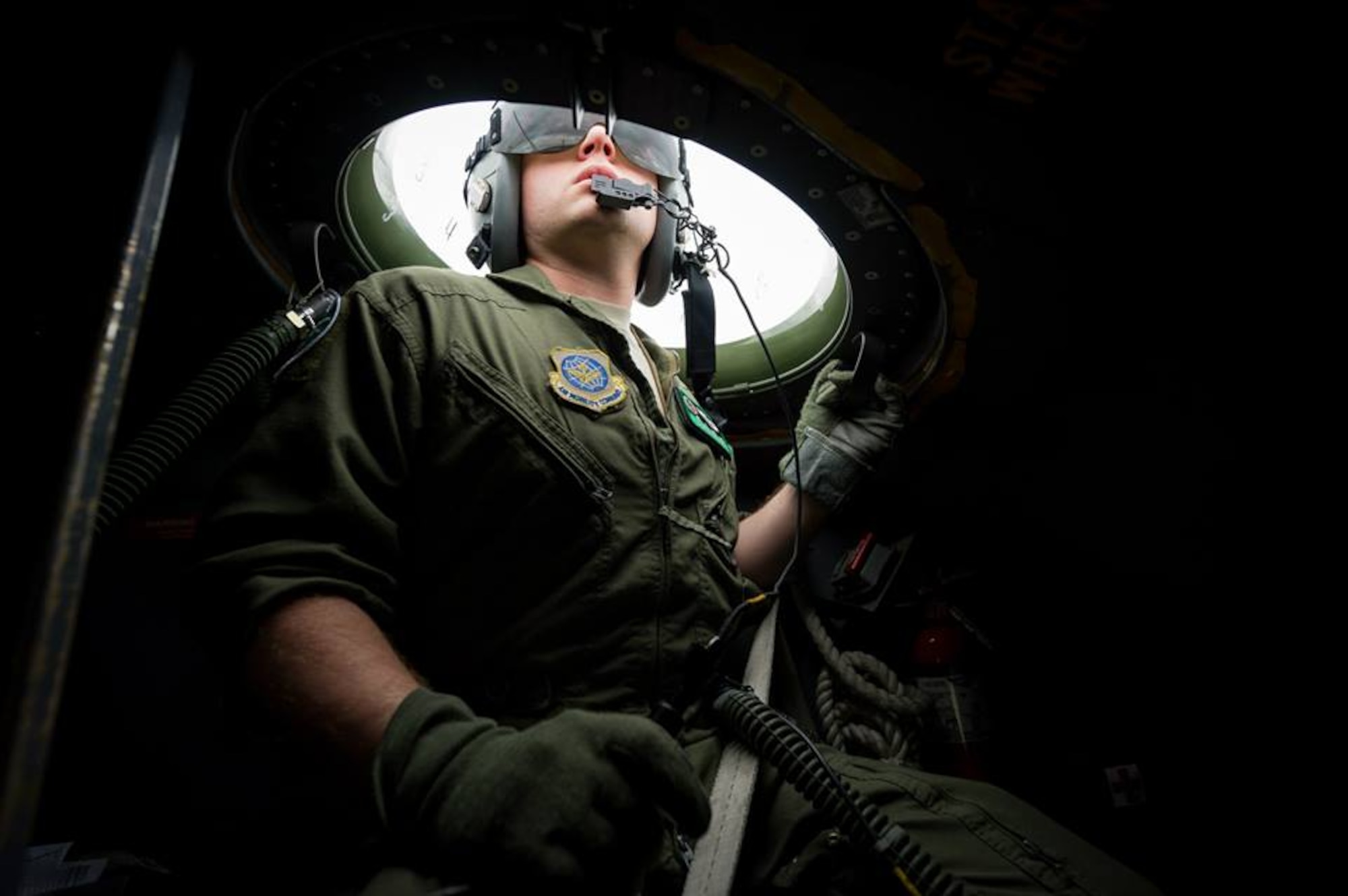 U.S. Air Force Capt. Conrad Ruiz, C-130 Hercules navigator with the 302nd Airlift Wing, Peterson Air Force Base, Colo., keeps a lookout while in the observation bubble during Maple Flag in Edmonton/Cold Lake, Alberta, Canada, May 28, 2014. Maple Flag is an international exercise designed to enhance the interoperability of C-130 aircrews, maintainers and support specialists in a simulated combat environment. (U.S. Air Force photo by Master Sgt. John R. Nimmo, Sr./Released) 4th Combat Camera Squadron— with Conrad Ruiz at Edmonton International Airport.