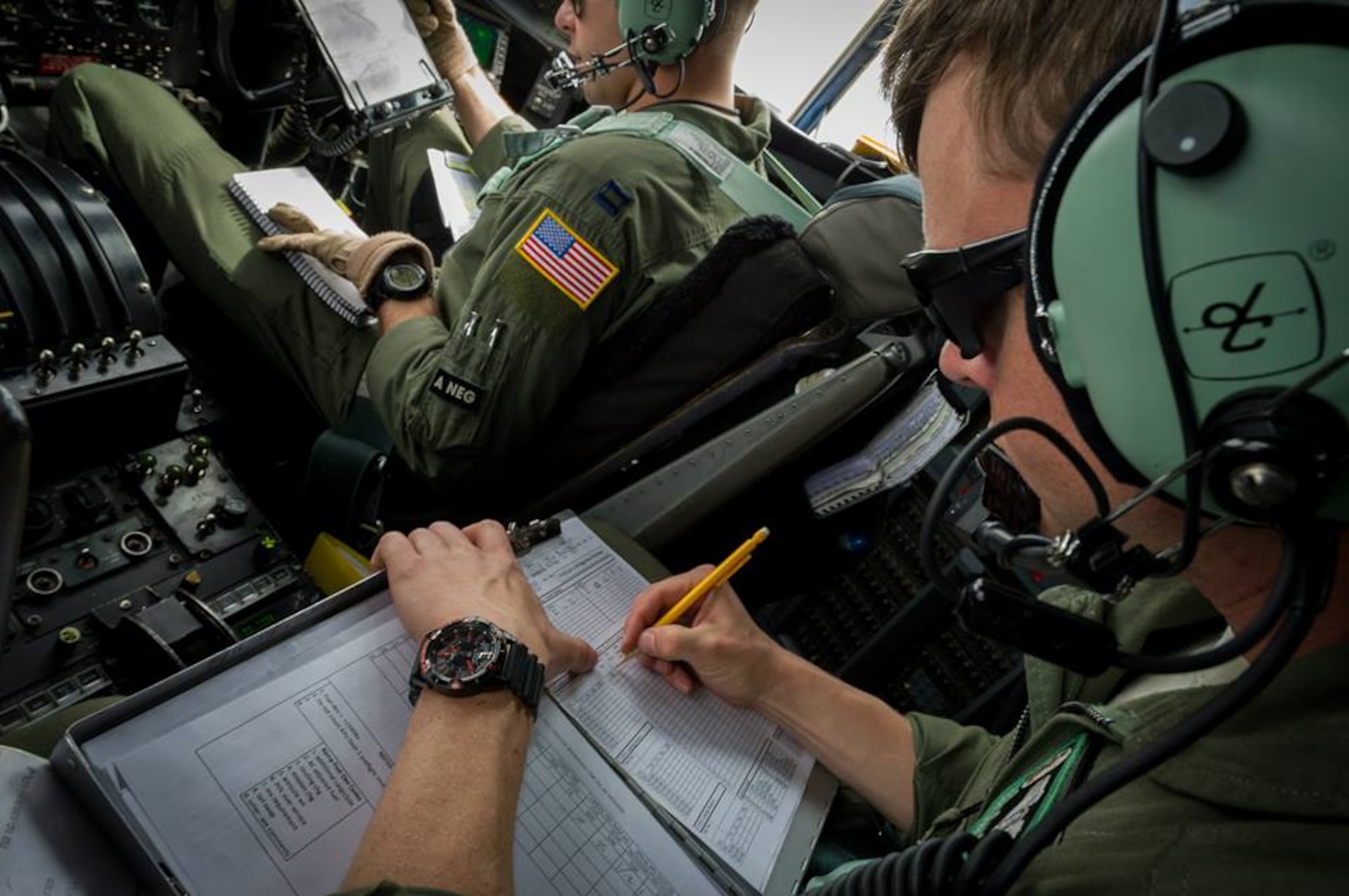 U.S. Air Force Staff Sgt. Peter Brosnan, C-130 Hercules flight engineer with the 302nd Airlift Wing, Peterson Air Force Base, Colo., records flight mission data during Maple Flag in Edmonton/Cold Lake, Alberta, Canada, May 28, 2014. Maple Flag is an international exercise designed to enhance the interoperability of C-130 aircrews, maintainers and support specialists in a simulated combat environment. (U.S. Air Force photo by Master Sgt. John R. Nimmo, Sr./Released) 4th Combat Camera Squadron— at Edmonton International Airport.