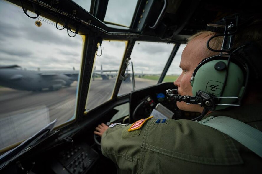 U.S. Air Force Capt. Phillip Chapman, C-130 Hercules pilot with the 302nd Airlift Wing, Peterson Air Force Base, Colo., taxis into position on the runway during Maple Flag in Edmonton/Cold Lake, Alberta, Canada, May 28, 2014. Maple Flag is an international exercise designed to enhance the interoperability of C-130 aircrews, maintainers and support specialists in a simulated combat environment. (U.S. Air Force photo by Master Sgt. John R. Nimmo, Sr./Released) 4th Combat Camera Squadron— with John Nimmo, Quinn Harris and Andy Chapman at Edmonton International Airport.