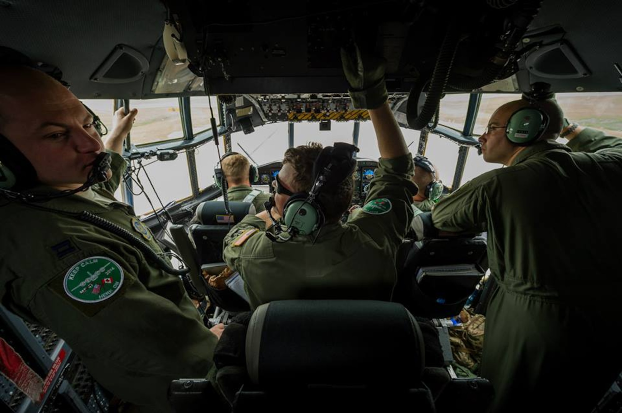 A U.S. Air Force C-130 Hercules aircrew with the 302nd Airlift Wing, Peterson Air Force Base, Colo., observe the taxiway before takeoff during Maple Flag in Edmonton/Cold Lake, Alberta, Canada, May 28, 2014. Maple Flag is an international exercise designed to enhance the interoperability of C-130 aircrews, maintainers and support specialists in a simulated combat environment. (U.S. Air Force photo by Master Sgt. John R. Nimmo, Sr./Released) 4th Combat Camera Squadron— with Andy Chapman at Edmonton International Airport.