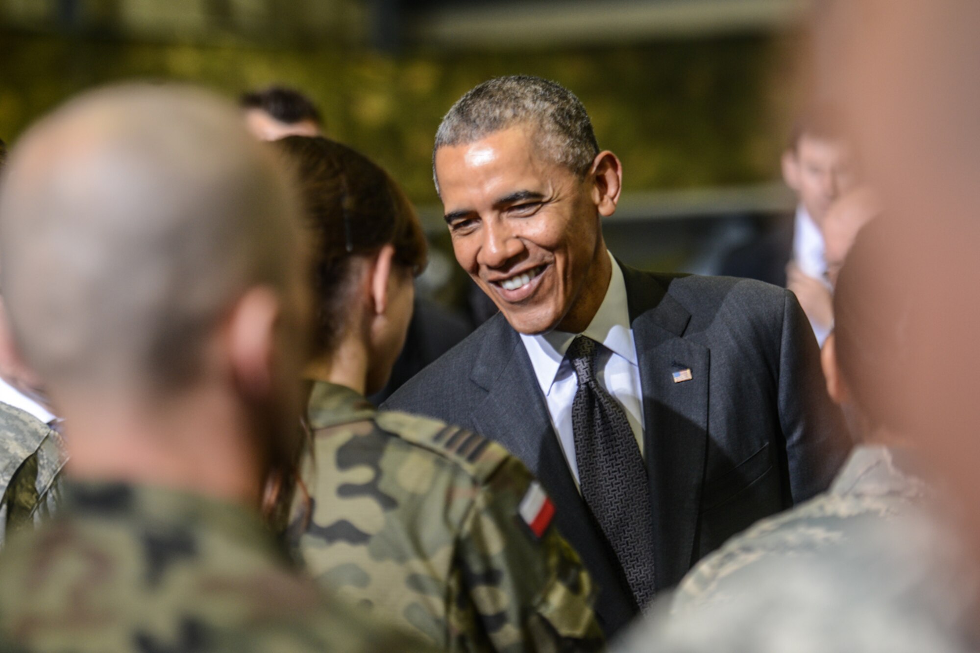 President Barack Obama meets with U.S. and Polish service members, June 3, 2014, at the Warsaw Chopin Airport in Warsaw, Poland. The presidents spoke about the two countries’ enduring partnership and commitment to sustaining regional peace and stability. The 52nd Operations Group, Aviation Detachment 1 at Poland’s Lask Air Base is one example of how the United States and Poland are strengthening their interoperability through planned rotational exercises.(Photo courtesy of U.S. Embassy-Warsaw/Released) 