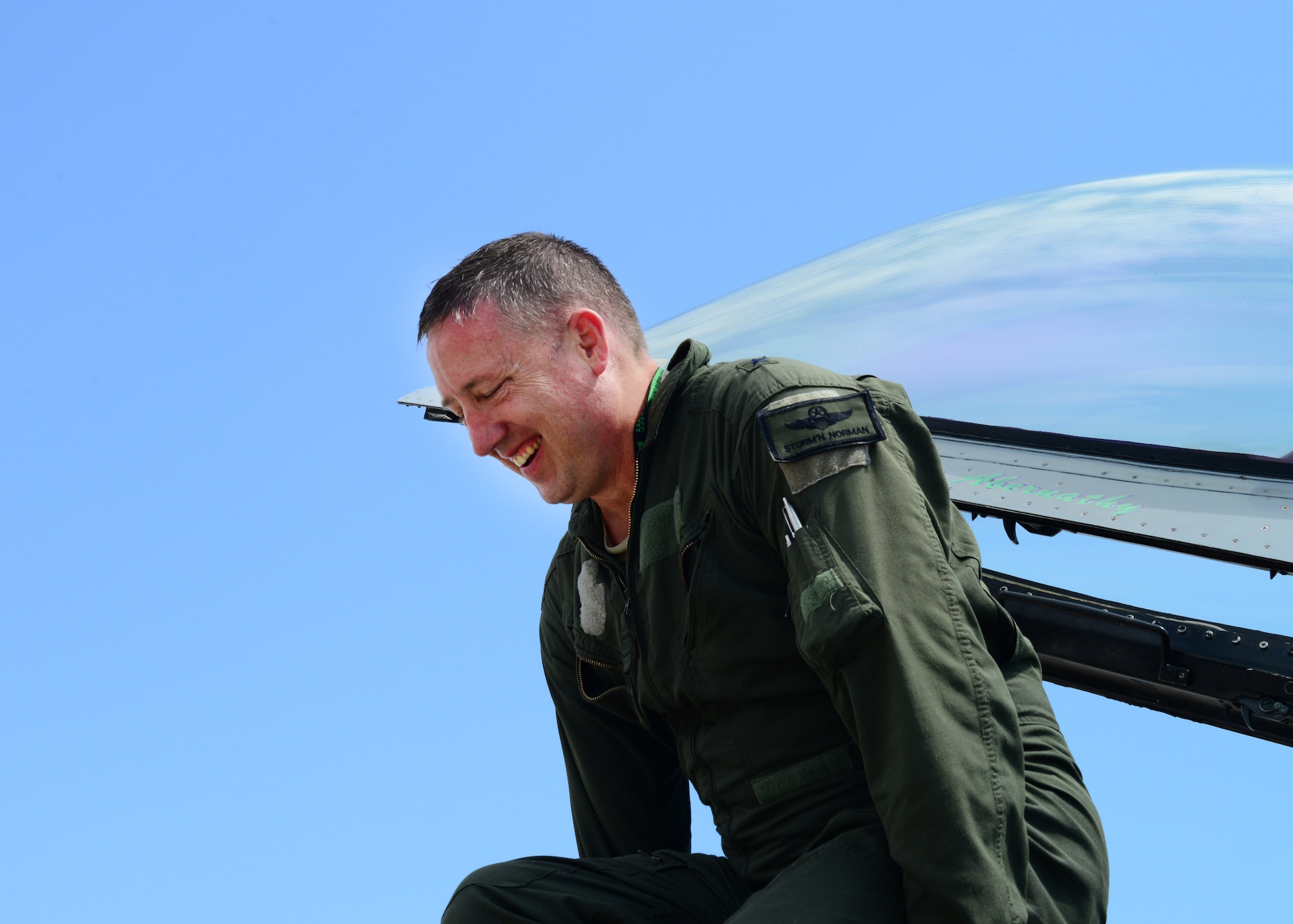 Brig. Gen. Jon A. Norman, 31st Fighter Wing commander, pulls himself out of the cockpit of an F-16 Fighting Falcon after completing his final flight on station, June 3, 2014, at Aviano Air Base, Italy. Norman has been selected for reassignment as the chief of staff, Pacific Air Forces headquarters. (U.S. Air Force photo/Airman 1st Class Ryan Conroy)