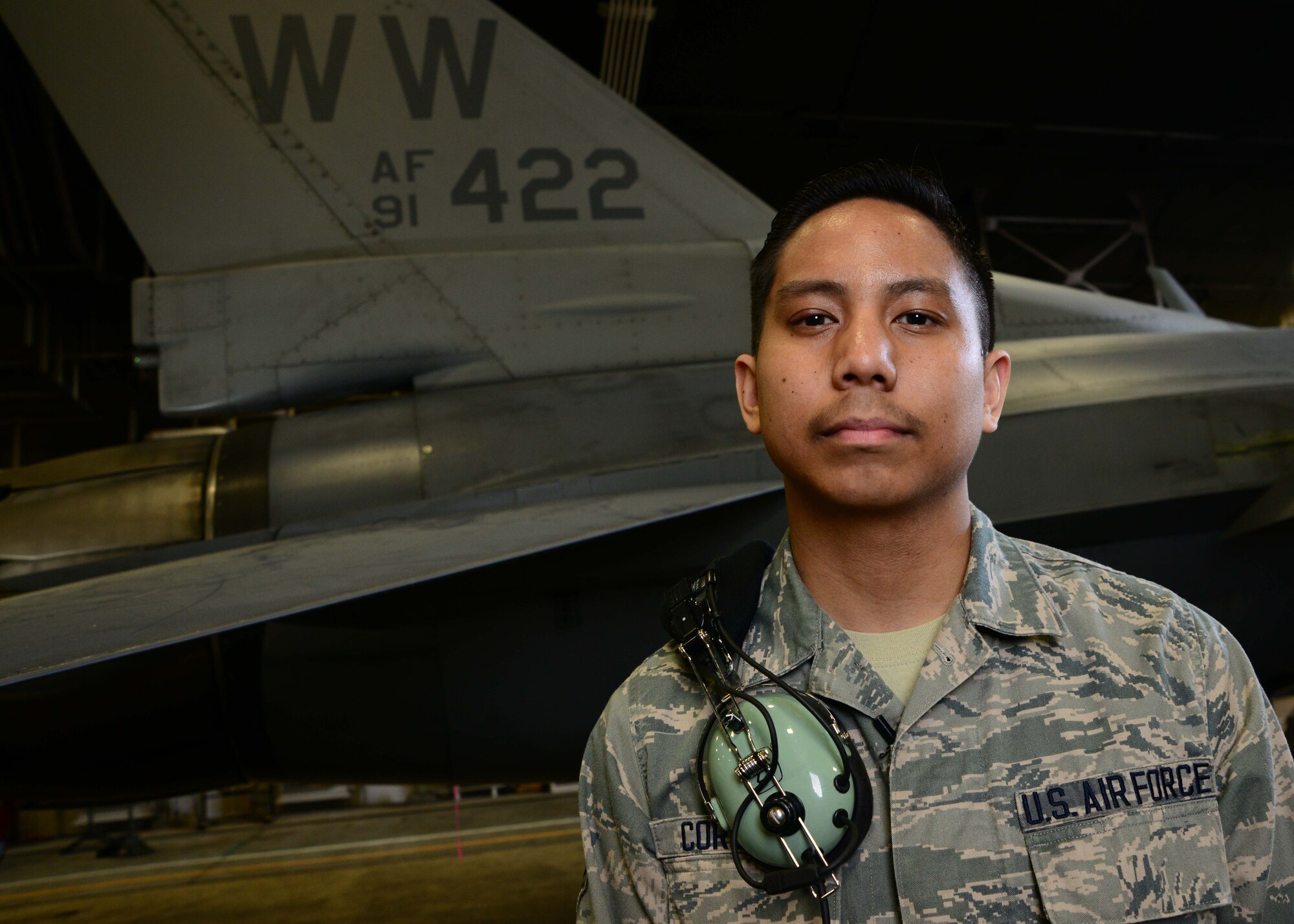 U.S. Air Force Senior Airman Norman Cordero, 14th Aircraft Maintenance Unit avionics technician, stands in front of an F-16 Fighting Falcon at Misawa Air Base, Japan, May 29, 2014. Cordero’s favorite part of the job is executing reconfiguration assignments such as giving a jet jamming or enhanced targeting and sensing capabilities. (U.S. Air Force photo/Senior Airman Derek VanHorn)