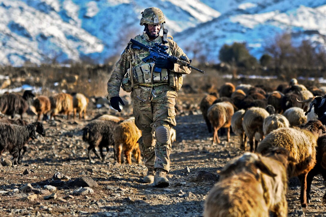 U.S. Army Staff Sgt. Jonathan Price conducts a security patrol near the village of Narizah in Afghanistan's Tani district, Feb. 10, 2012. Price is a squad leader assigned to the 501st Infantry Division's Company B, 1st Battalion Airborne.  

